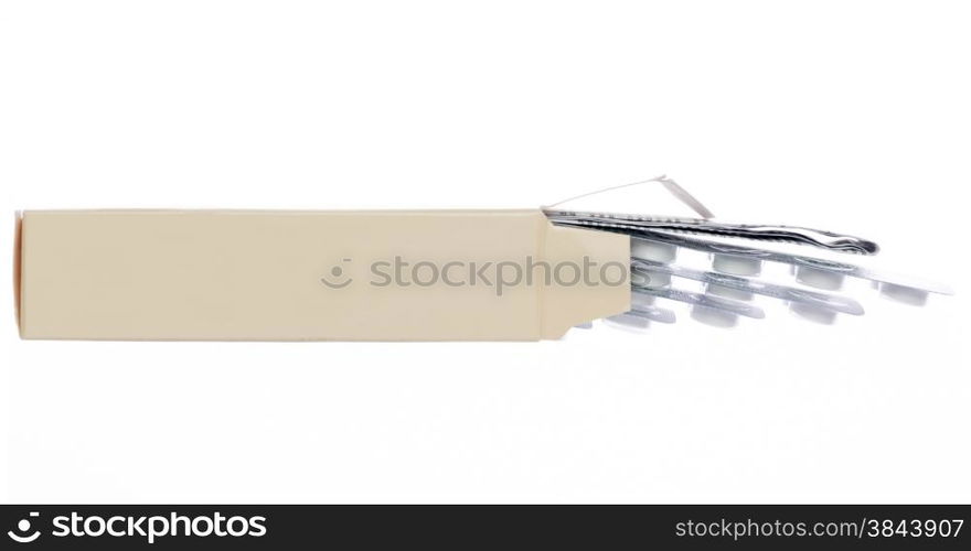 Light brown box with white pills blister pack on an isolated background. Light brown box with white pills blister pack