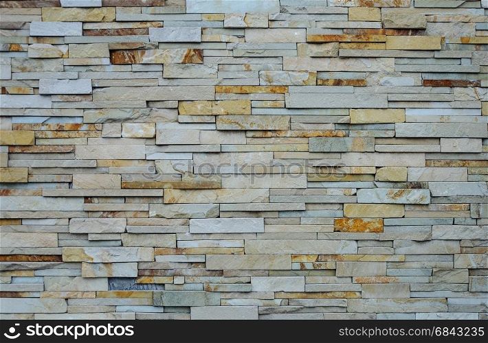 Light brown rough flat stones wall pattern