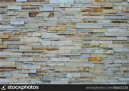 Light brown rough flat stones wall pattern