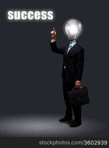 Light bulb and a business person as symbols of creativity in business