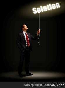 Light bulb and a business person as symbols of creativity in business