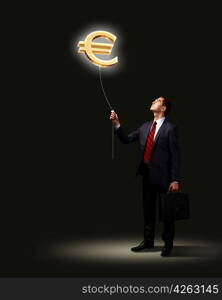 Light bulb and a business person as symbols of creativity in business