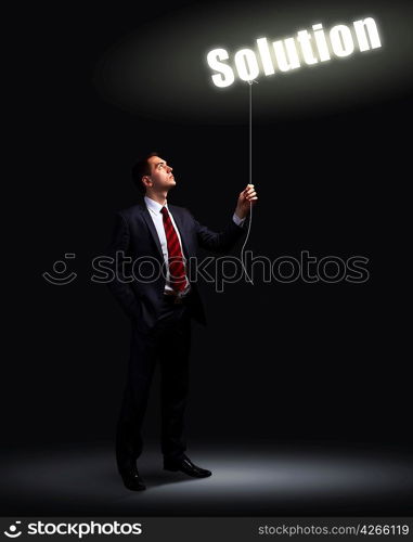 Light bulb and a business person as symbols of creativity in business