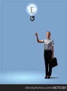 Light bulb and a business person as symbols of creativity in business