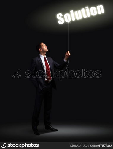 Light bulb and a business person as symbols of creativity in business