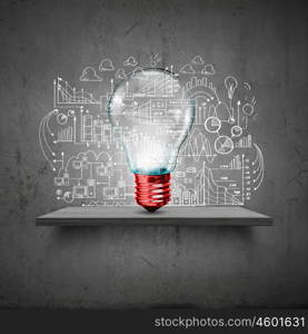 Light bulb and drawing business strategy at background. Ideas for your business