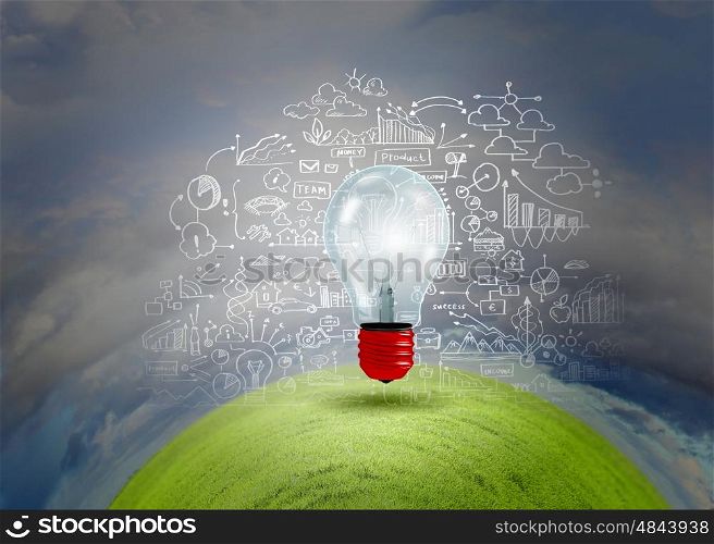 Light bulb and drawing business strategy at background. Ideas for your business