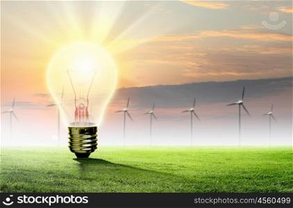 Light bulb and nature. Image of light bulb against nature background. Ecological concept