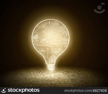 Light bulb. Conceptual image with light bulb and cement surface