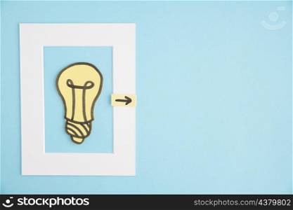 light bulb frame with directional arrow blue background