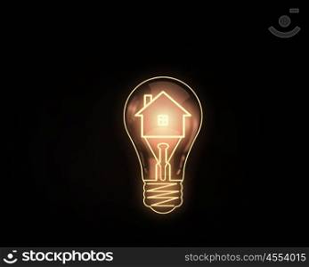 Light bulb. Home icon inside of light bulb on dark background