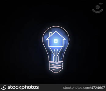 Light bulb. Home icon inside of light bulb on dark background