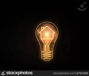 Light bulb. Home icon inside of light bulb on dark background