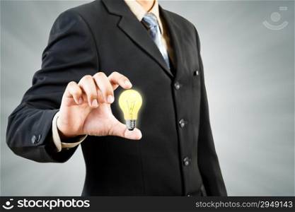 Light bulb in businessman hand