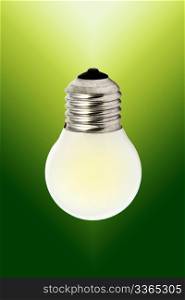 Light bulb isolated on green background