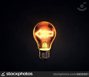 Light bulb. Light bulb with arrow inside on dark background