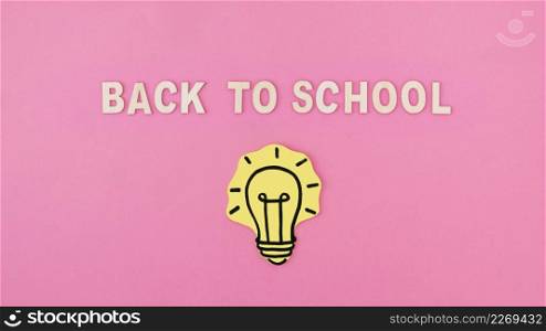 light bulb near back school writing