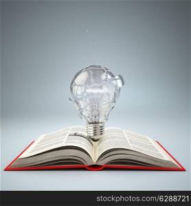 Light bulb on open book. Idea or creativity concept. Education. 3d