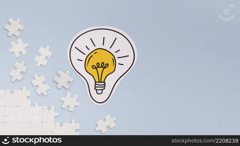 light bulb puzzle pieces with copy space