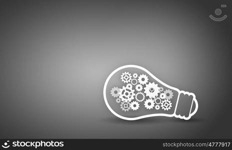 Light bulb with gears. Conceptual image with light bulb filled with gears