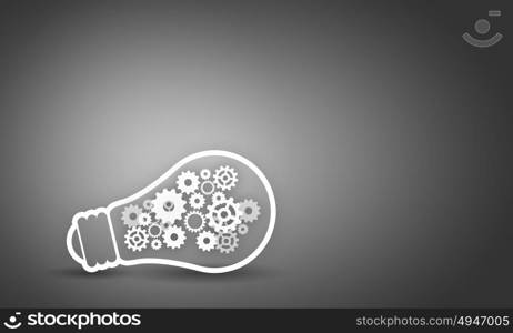 Light bulb with gears. Conceptual image with light bulb filled with gears