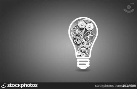Light bulb with gears. Conceptual image with light bulb filled with gears
