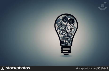 Light bulb with gears. Conceptual image with light bulb filled with gears