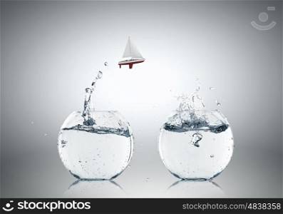 Light bulb with ship. Concept of ecology with light bulb filled with water and boat floating inside