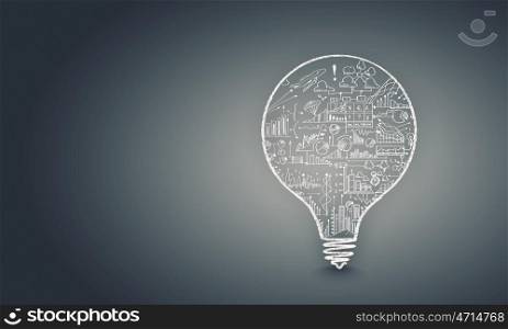 Light bulb with sketches. Conceptual image with light bulb filled with business sketches