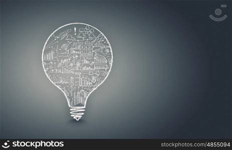 Light bulb with sketches. Conceptual image with light bulb filled with business sketches