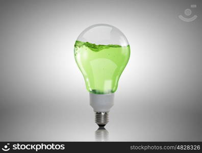 Light bulb with water. Energy and ecology concept with light bulb with water inside