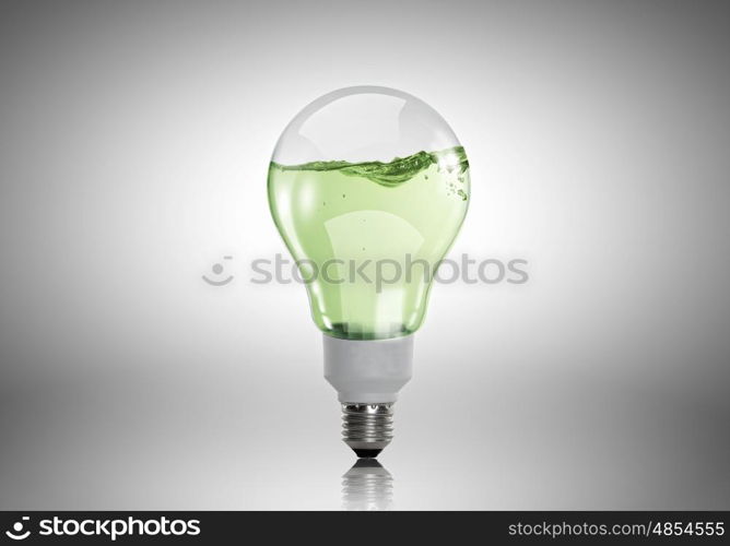 Light bulb with water. Energy and ecology concept with light bulb with water inside