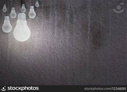 Light Bulbs Concept gray cement background