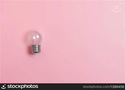 Light bulbs on pink background with copy space. Creative idea Concept.