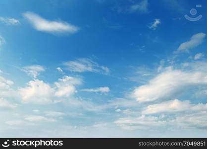 light cumulus clouds in the blue sky