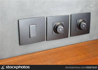 light electrical switch with wall background.