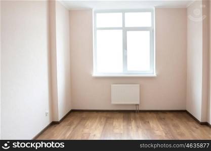 Light empty room with big white isolated window and wooden floor