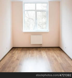 Light empty room with big white isolated window and wooden floor