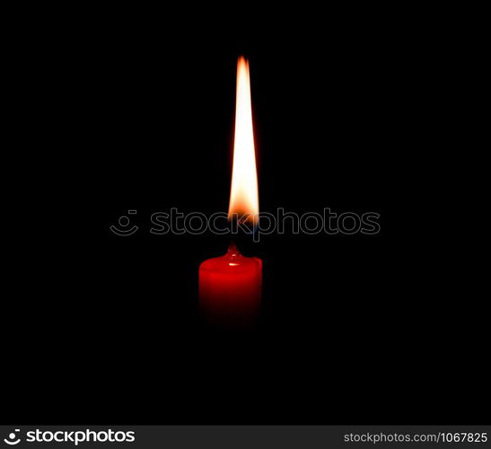 light flame candle burning brightly on black background