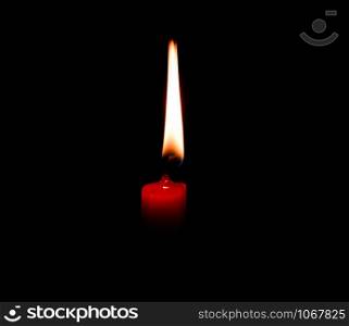 light flame candle burning brightly on black background