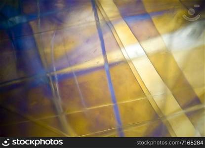 light graphics: microphoto of wrapped plastic foil in polarized light