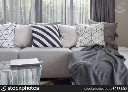 Light gray sofa with varies pattern pillows in modern living cor. Light gray sofa with varies pattern pillows in modern living corner