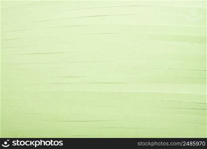 Light green cut paper strips background. Parallel green strips texture.