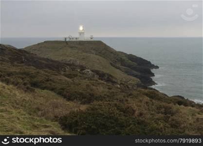 Light house on Strumble Head, Ynysmeicl or St. Michael?s Island. Near Fishguard, Pembrokeshire, Wales, United Kingdom, Europe