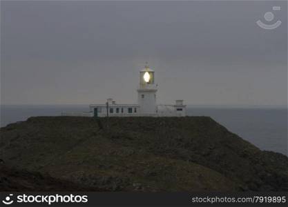Light house on Strumble Head, Ynysmeicl or St. Michael?s Island. Near Fishguard, Pembrokeshire, Wales, United Kingdom, Europe