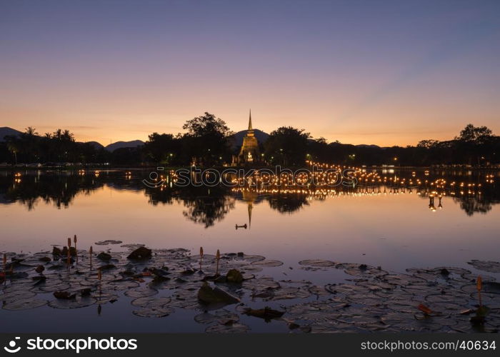 light in Buddha Statue at Temple in Loy Kratong Festival, Sukhothai Historical park , Thailand