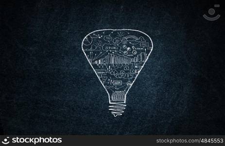 Light in darkness. Light bulb with sketches inside on dark background
