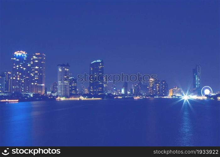 light of city on the river at night background