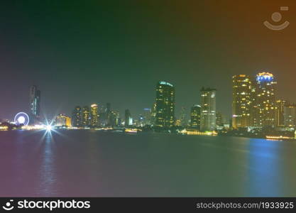 light of city on the river at night background