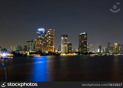 light of city on the river at night background